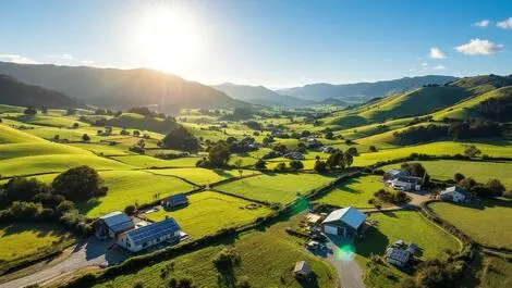 New zealand rural landscape solar panels on farms green hills blue sky